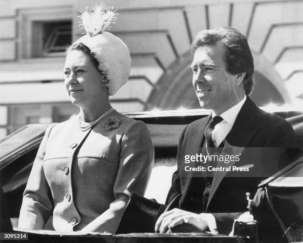 Princess Margaret and her husband Antony Armstrong-Jones, the Earl of Snowdon, attend the Trooping the Colour ceremony at Buckingham Palace, London.
