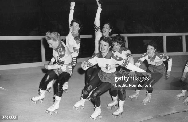 Female members of the US roller skating team practise together at a Harringay rink for the upcoming Roller Derby.