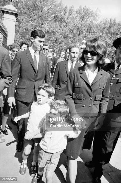 Jackie Kennedy, widow of John F. Kennedy walking in Green Park, London, with her son John Jr. And Anthony, the son of her sister Lee Radziwill.
