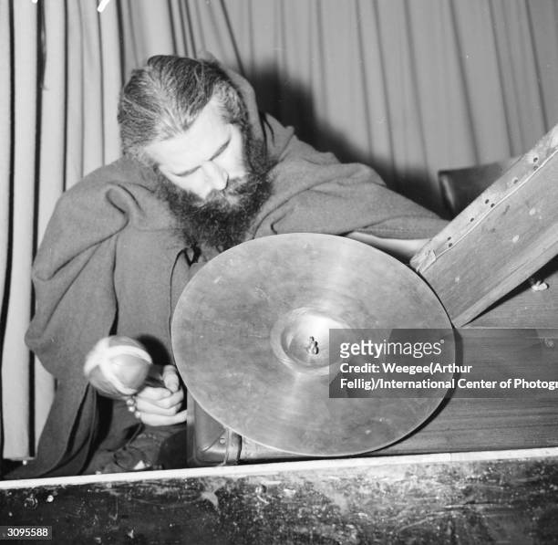 Blind American composer and street musician Moondog works from a pitch in New York's Times Square.