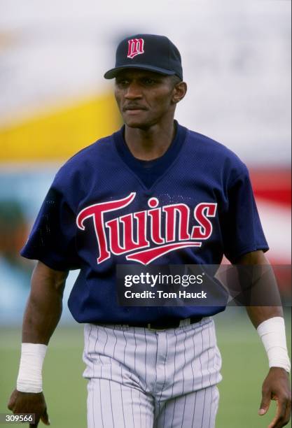 Otis Nixon of the Minnesota Twins looks on during a spring training game against the Texas Rangers at the Charlotte County Stadium in Port Charlotte,...