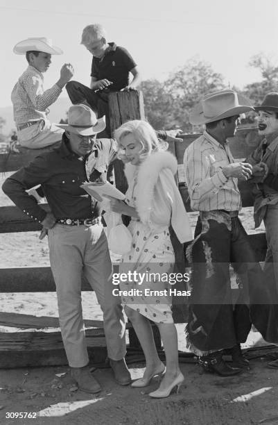 Cast members Clark Gable , Marilyn Monroe and Montgomery Clift during the filming of 'The Misfits' on location in the Nevada Desert.