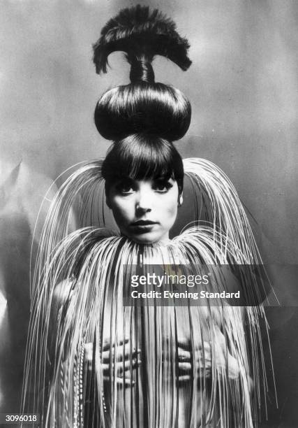 Italian fashion model and actress Elsa Martinelli wearing her hair in a giant topknot.