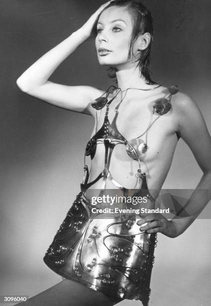 Seventies fashion model wearing an aluminium dress by designer Emmanuel Ungaro.