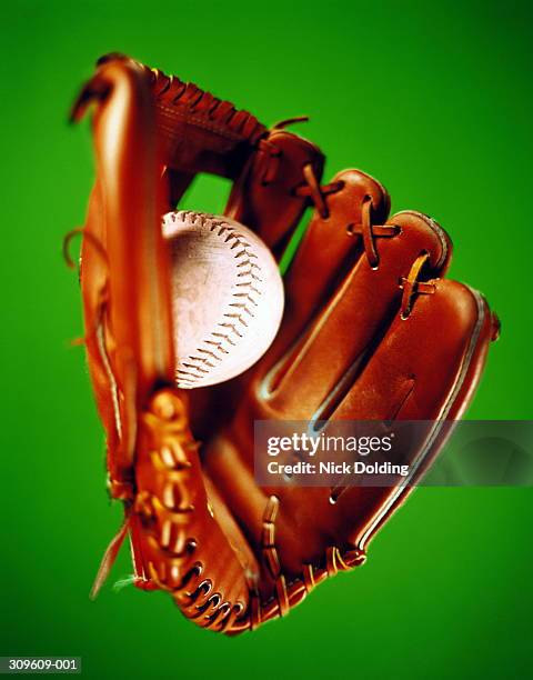 close-up of leather baseball glove and ball - baseball glove isolated stock pictures, royalty-free photos & images