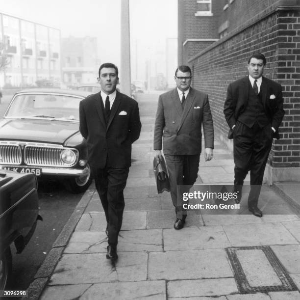 Notorious East End gangsters Ronnie and Reggie Kray, on their way to the Thames Street court in London.