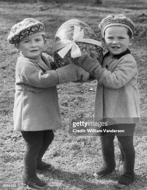 Twins from Castlebar Nursery School in Sydenham who have been evacuated to Mersham-le-Hatch near Ashford in Kent celebrate Easter whilst awaiting...