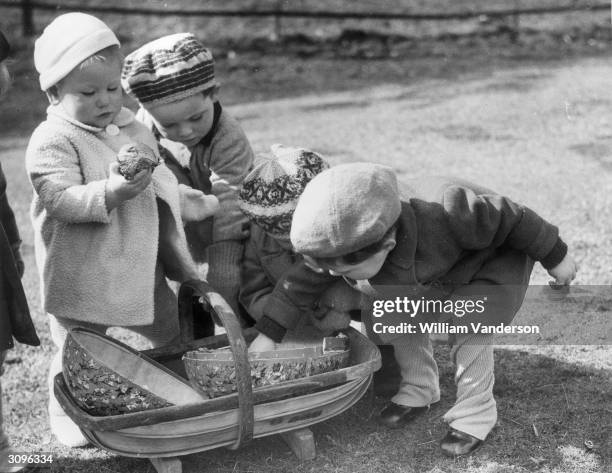 Orphans from Castlebar Nursery School in Sydenham who have been evacuated to Mersham-le-Hatch near Ashford in Kent celebrate Easter whilst awaiting...