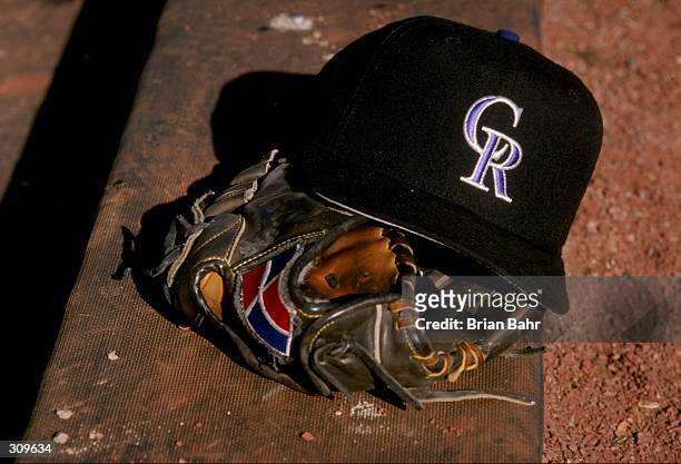 General view of a glove and a Colorado Rockies cap during a spring training game between the Colorado Rockies and the San Francisco Giants at the Hi...