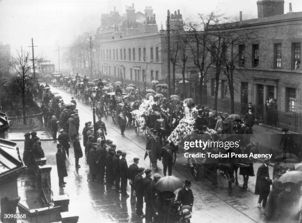 The funeral cortege of Henry Orcell makes its way down Fairfield Road in Bow, east London.