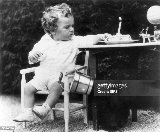 Charles Augustus Lindbergh Jnr, son of the American aviator, on his first birthday. A few months later he was kidnapped from his home and murdered.