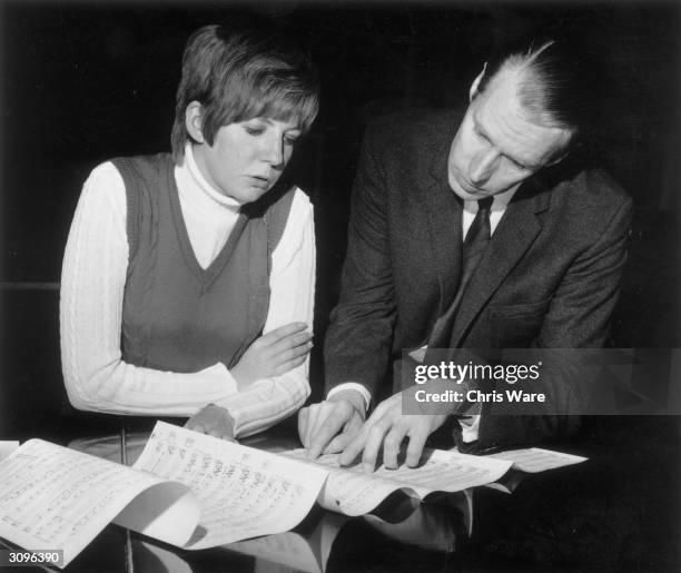 George Martin, the producer of the Beatles with Cilla Black, whose single 'Work Is A Four Letter Word' he is to produce.