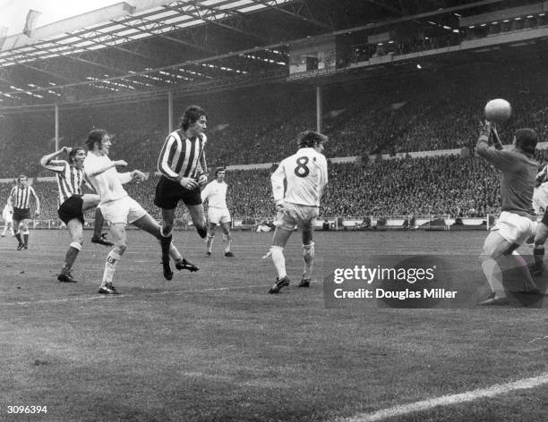 Leeds United players Norman Hunter, David Harvey and Allan Clarke watch as the Sunderland footballer Ian Porterfield scores the winning goal during...