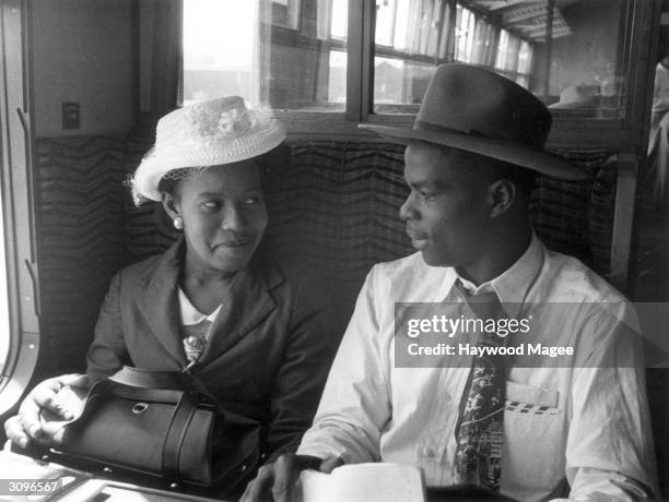 West Indians immigrants travel from Southampton to London Victoria. They arrived with 700 others at Southampton dock, and have come to look for work...