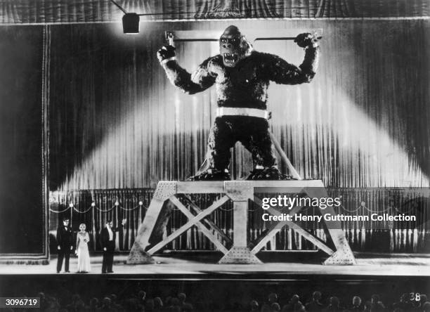 The giant ape is displayed on stage in New York by its captors in a scene from RKO's classic movie 'King Kong', directed by Merian C Cooper.