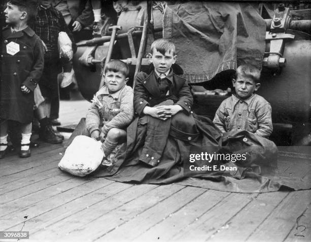 Three young orphans from Bilbao arrive at Southampton aboard the liner Habana. They, and over 4,000 other Basque children, will be housed in Britain...