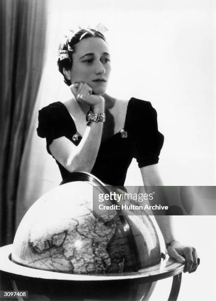 Wallis Simpson, the Duchess of Windsor , wearing her Cartier emerald engagement ring and a sapphire and diamond bracelet.