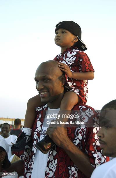 Lamar Odom of the Miami Heat and his son attend the Miami Heat Family Festival at the Doubletree Surfcomber Hotel on February 23, 2003 in South...