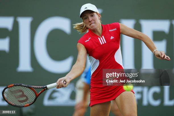 Justin Henin-Hardenne of Belgium returns a shot against Marta Marrero of Spain at the Pacific Life Open March 15, 2004 at the Indian Wells Tennis...