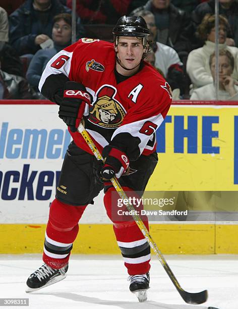 Defenseman Wade Redden of the Ottawa Senators passes the puck during the game against the Pittsburgh Penguins at Corel Centre on January 22, 2004 in...