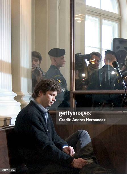 French singer Bertrand Cantat sits in court on the opening day of his trial on March 16, 2004 in Vilnius. Cantat is charged with murdering his movie...