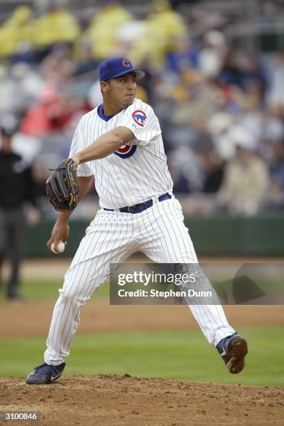 Pitcher Carlos Zambrano of the Chicago Cubs pitches during the Spring Training game against the San Francisco Giants on March 4, 2004 at HoHoKam Park...