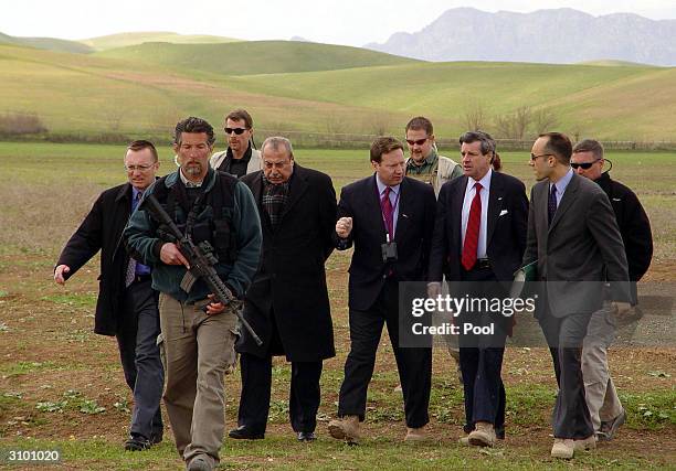 Civil administrator in Iraq, Paul Bremer is flanked by aides and bodyguards March 16, 2004 in Halabja, Iraq near the Iranian border. Bremer was...