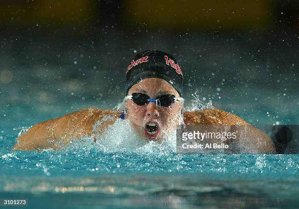 Jamie Reid swims the 200 meter fly during the Conoco Phillips Spring National Championships at the YMCA Aquatics Center on February 11, 2004 in...
