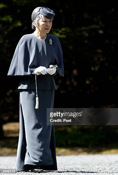 Japanese Empress Michiko arrives at the Imperial graves of Emperor Akihito's father and mother on March 17, 2004 in Tokyo, Japan. Japan's Royal...
