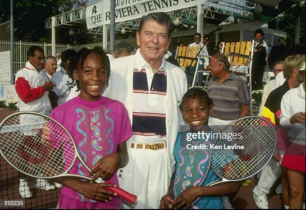 Serena Williams and her sister Venus Williams stand with former president Ronald Reagan at a tennis camp in Florida. Mandatory Credit: Ken Levine...
