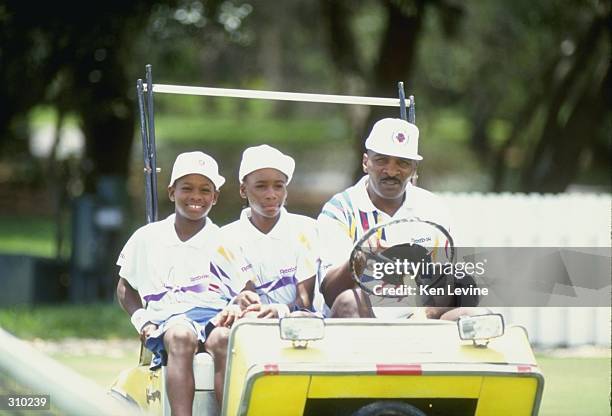 Serena Williams and her sister Venus Williams ride with their father Richard Williams at a tennis camp in Florida. Mandatory Credit: Ken Levine...