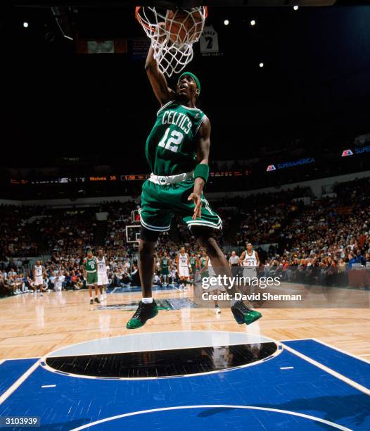 Ricky Davis of the Boston Celtics dunks the ball during the game against the Minnesota Timberwolves at the Target Center on March 7, 2004 in...