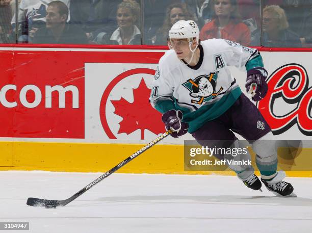 Center Sergei Fedorov of the Mighty Ducks of Anaheim advances the puck during the game against the Vancouver Canucks at General Motors Place on...