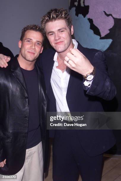 British pop star Jason Brown of the former pop group "Five" and Irish pop star Bryan McFadden of the pop group "Westlife" attend the "Coast to Coast"...