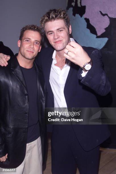 British pop star Jason Brown of the former pop group "Five" and Irish pop star Bryan McFadden of the pop group "Westlife" attend the "Coast to Coast"...