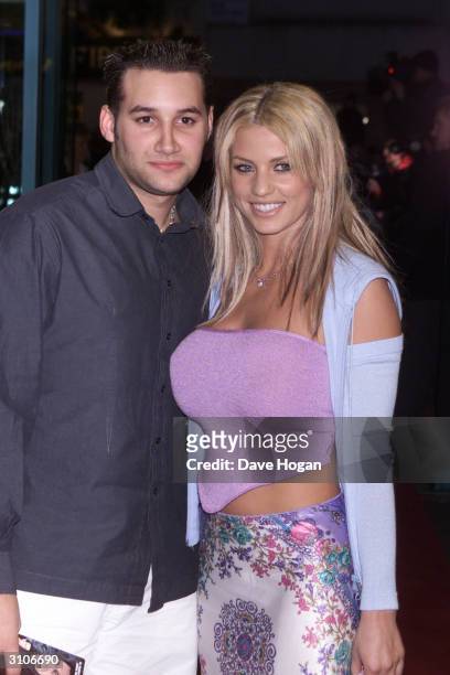 British pop star Dane Bowers and British glamour model Jordan arrive at the UK premiere of the film "Any Given Sunday" on March 29, 2000 in London.