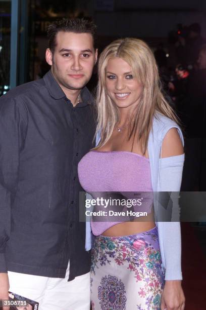 British pop star Dane Bowers and British glamour model Jordan arrive at the UK premiere of the film "Any Given Sunday" on March 29, 2000 in London.