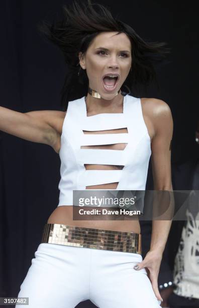 British pop star Victoria Beckham performs on stage at "Party In The Park" held at Hyde Park on July 9, 2000 in London.
