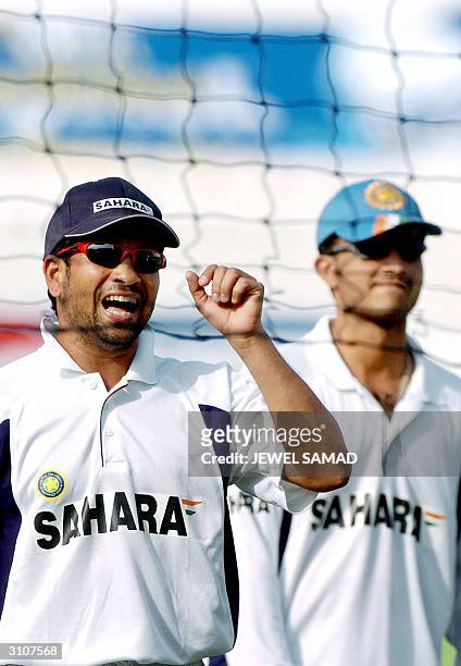 Indian cricket captain Sourav Ganguly and teammate Sachin Tendulkar play volleyball during a practice session at the Arbab Niaz Stadium in Peshawar,...