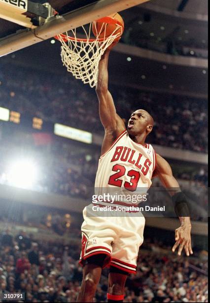 Guard Michael Jordan of the Chicago Bulls goes up for two during a game against the Atlanta Hawks at the United Center in Chicago, Illinois. The...