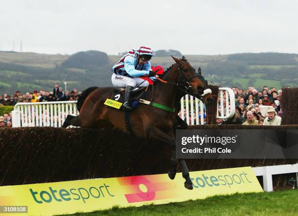 Jim Culloty and Best Mate clear the last fence in The totesport Cheltenham Gold Cup Chase on the third day of the annual National Hunt Festival held...