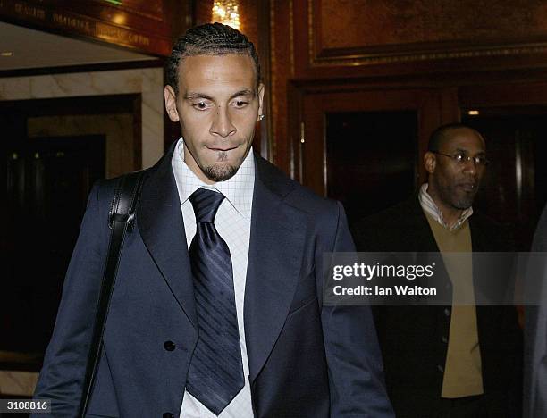 Manchester United footballer Rio Ferdinand leaves a press conference after his appeal to lift his eight month ban for missing a drugs test failed on...