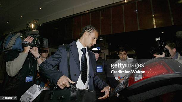 Manchester United footballer Rio Ferdinand leaves a press conference after his appeal to lift his eight month ban for missing a drugs test failed on...