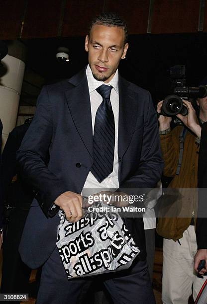 Manchester United footballer Rio Ferdinand leaves a press conference after his appeal to lift his eight month ban for missing a drugs test failed on...