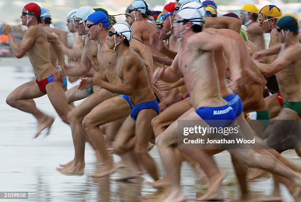 australian surf lifesaving championships - young men in speedos stock-fotos und bilder