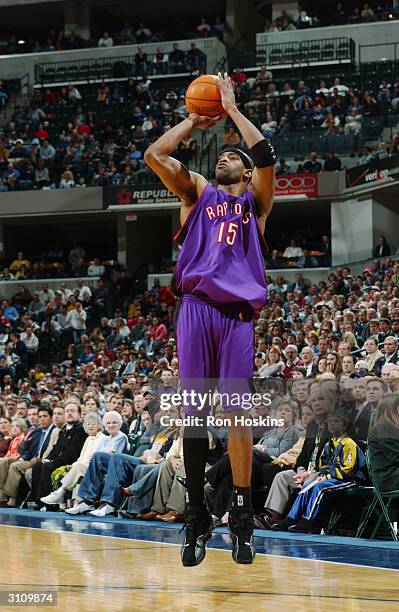 Vince Carter of the Toronto Raptors shoots a jumper during the game against the Indiana Pacers at Conseco Fieldhouse on March 9, 2004 in...