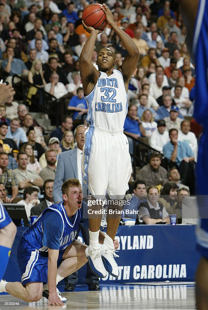 Af Rashad Rashad McCants of the North Carolina Tar Heels shoots over Nick Welch ...