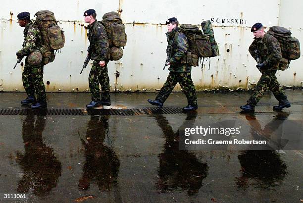 Soldiers prepare, as they get ready to deploy to Kosovo on March 19, 2004 in Cirencester. The UK Spearhead Battalion, 1st Battalion, The Royal...