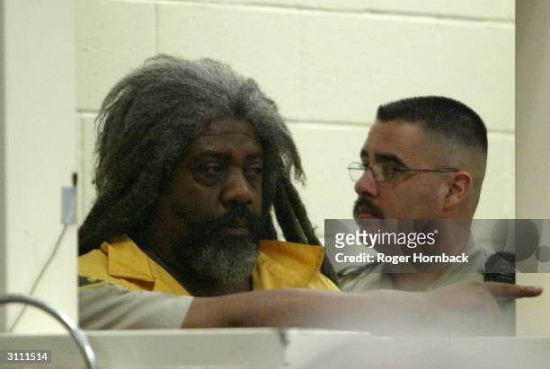 Accused killer Marcus Wesson waits to see the judge during his arraignment March 17, 2004 in Fresno, California. Wesson is accused of shooting nine...