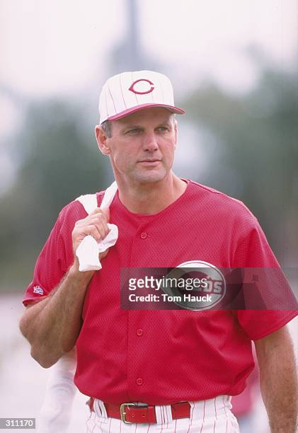 First base coach Ron Oester of the Cincinnati Reds looks on during a spring training game against the Texas Rangers at the Ed Smith Stadium in...